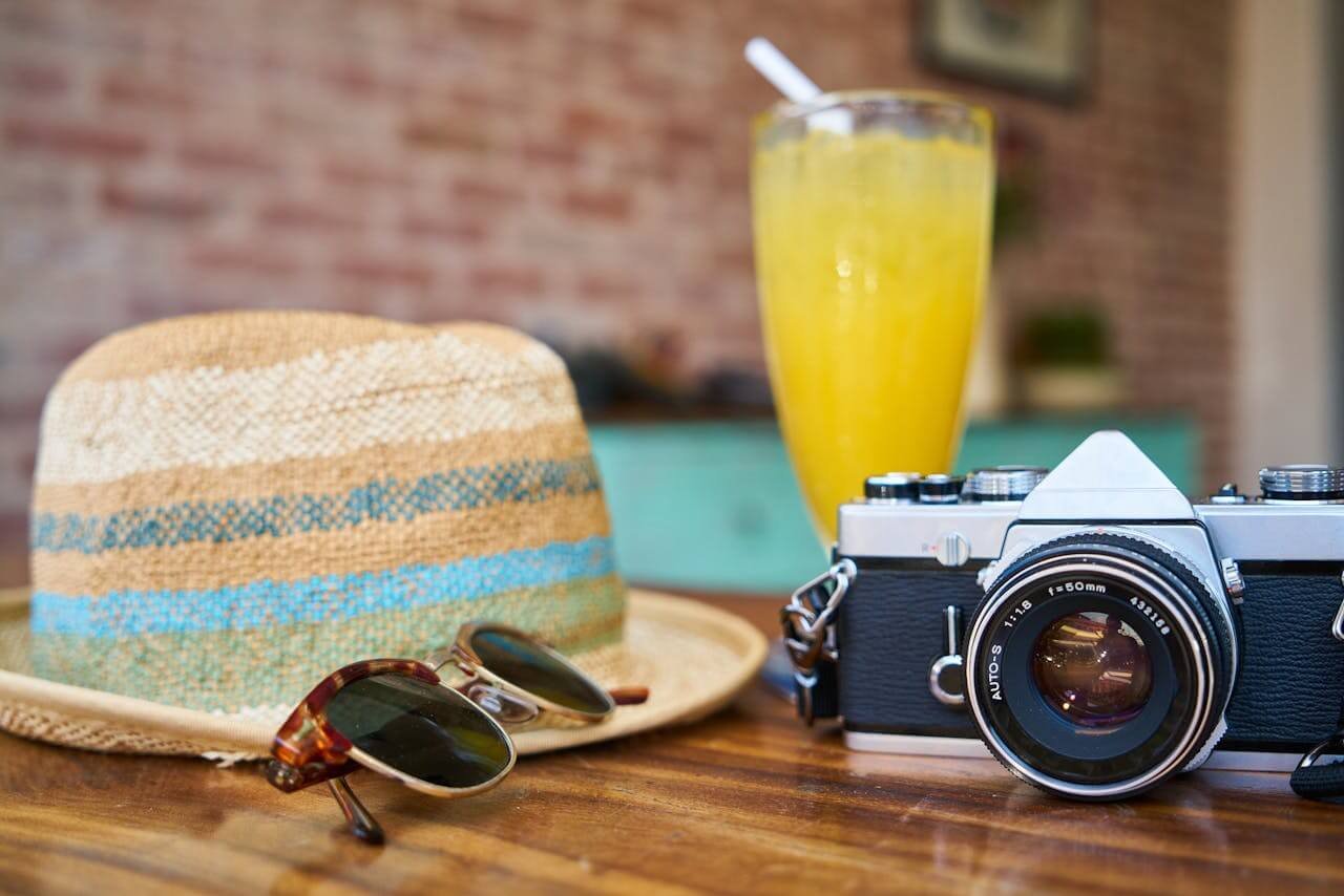 Sun glasses, camera and hat