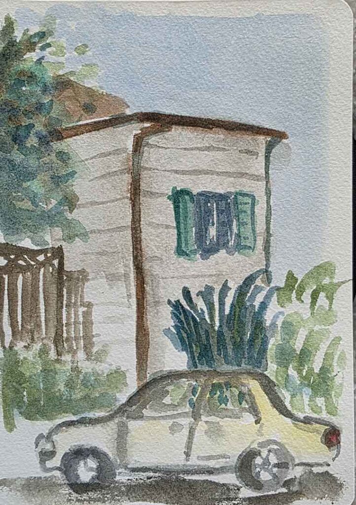 House and car in sketchbook